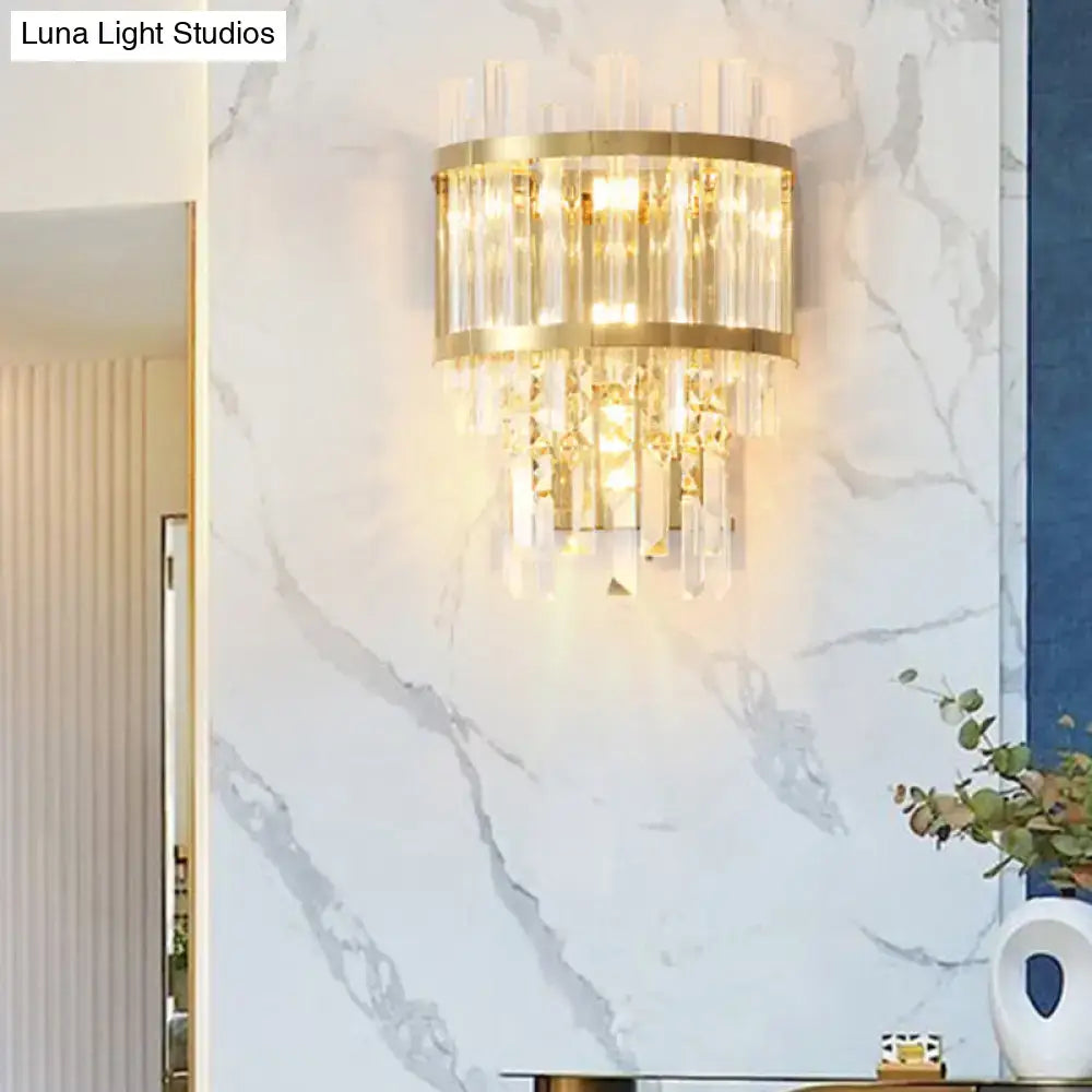 Modern gold-toned wall light with vertical crystal rods and faceted crystals wall mounted fixture width ideal for dining room
