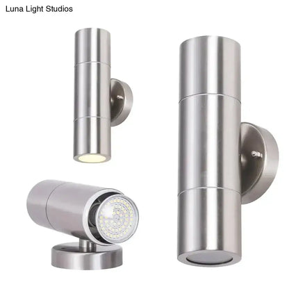 Modern silver cylindrical stainless steel outdoor wall sconces with sleek dual led lights for minimalist exterior lighting