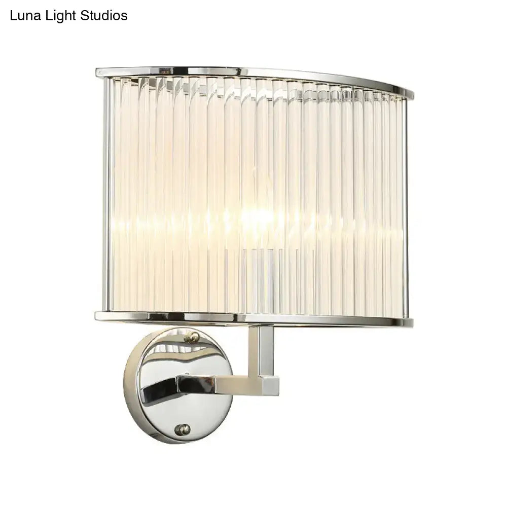 Modern silver finish wall lamp featuring a chrome base and clear crystal curved ribbed glass shade for living room