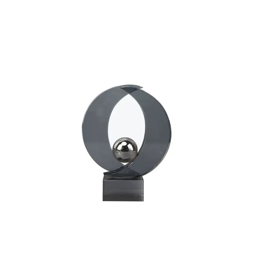 Modern silver geometric crystal sculpture featuring a sleek dark gray metallic ring with a polished silver sphere for home decor