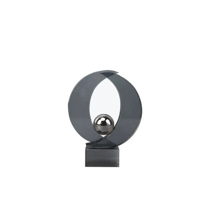 Modern silver geometric crystal sculpture featuring a sleek dark gray metallic ring with a polished silver sphere for home decor