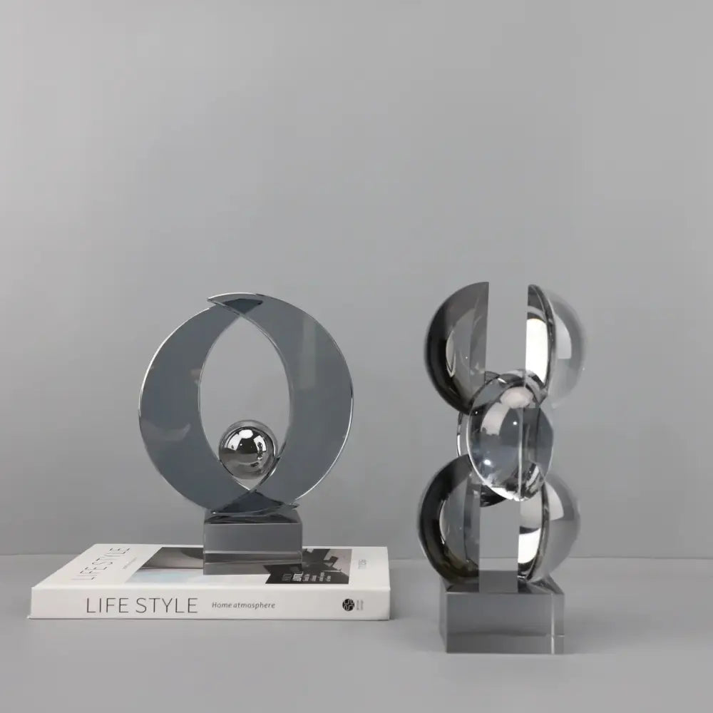Modern silver geometric crystal sculpture with interlocking circular elements for home decor by decorbites geometric crystal