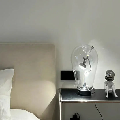Modern silver glass desk lamp with clear bulb-shaped glass and adjustable arm from decorbites glass desk collection