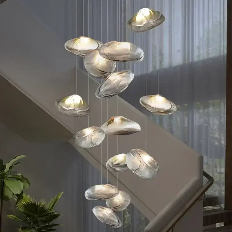 Modern silver glass led chandelier with shell pendant design and warm internal lighting for dining room use