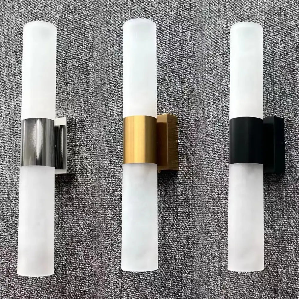 Three modern led wall lamps with frosted glass cylinders and silver gold and black metallic bands for bedroom decorbites wall lamp
