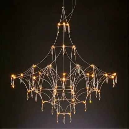 Modern silver pendant light with delicate metal frame and crystal pendants as a focal point in modern design dining room
