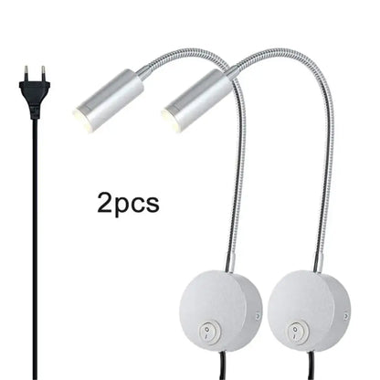 Two sleek silver gooseneck led wall lights with flexible metal arms and white circular bases for wall light reading