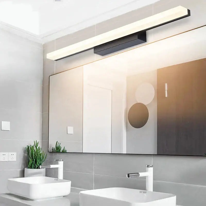 Modern black and white led vanity wall light with sleek rectangular design for minimalist bathroom decor