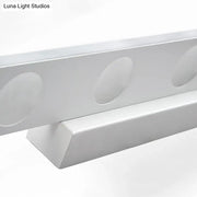 Modern silver oblong acrylic led wall light bathroom vanity mirror featuring a silver metallic channel rail with oval cutouts