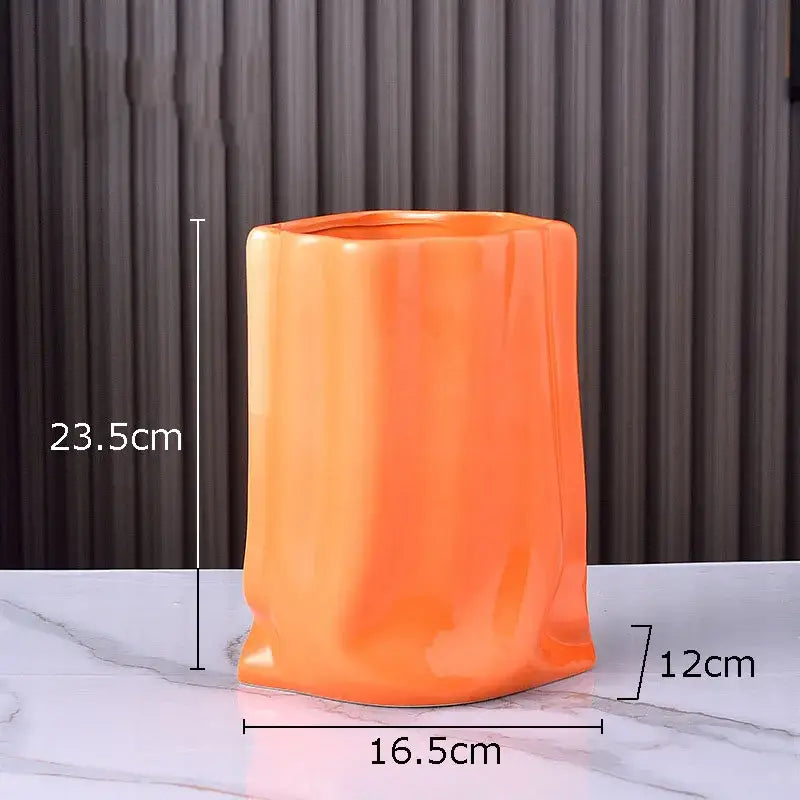 Modern silver pleated texture ceramic vase with vibrant orange glossy finish and sculpted sides for living room decorbites gold plated style