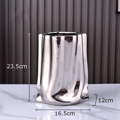 Modern silver pleated texture ceramic vase with shiny metallic sculpted body for living room decorbites gold plated style