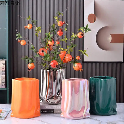 Modern silver metallic ceramic vase with pleated texture and geometric design for living room decorbites gold plated style