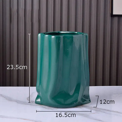 A glossy teal ceramic vase with pleated texture and a slightly flared base for modern living room decorbites gold plated style