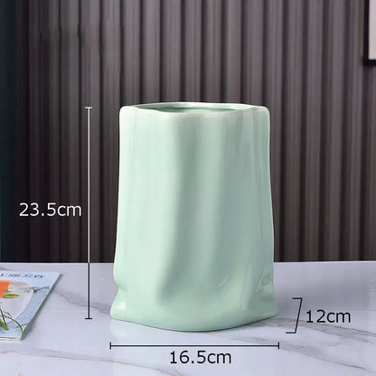 Modern silver pleated texture ceramic vase in light green with a sleek glossy finish for living room decorbites gold plated style