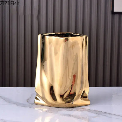 Gold plated pleated modern ceramic vase with glossy texture and sculpted design for living room decorbites decor