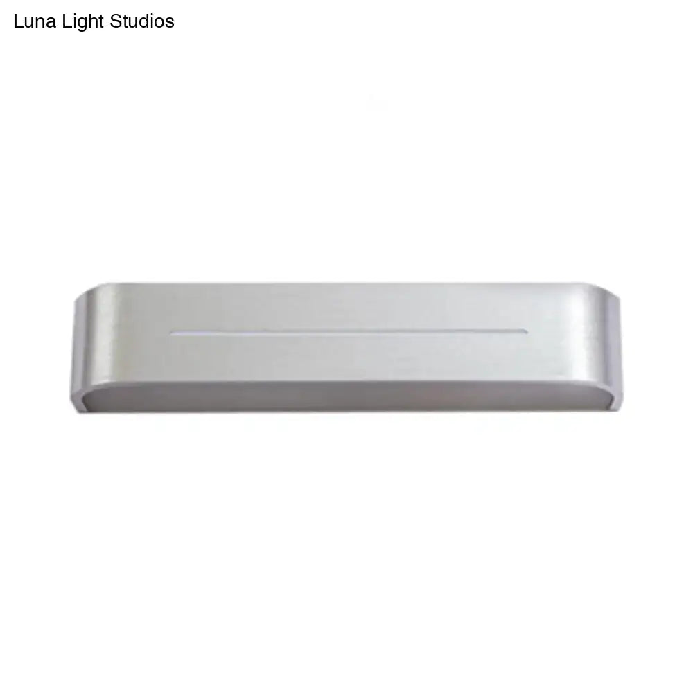 Modern silver rectangular led wall sconce with aluminum shade featuring sleek design and horizontal groove detail for bedroom use