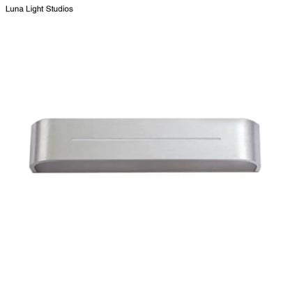 Modern silver rectangular led wall sconce with aluminum shade featuring sleek design and horizontal groove detail for bedroom use