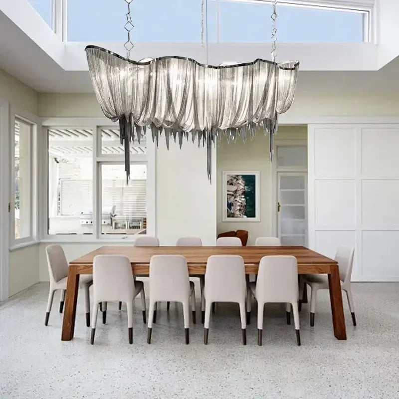 Modern silver tassel chain chandelier with cascading sculptural design for dining room decorbites gold tassel style