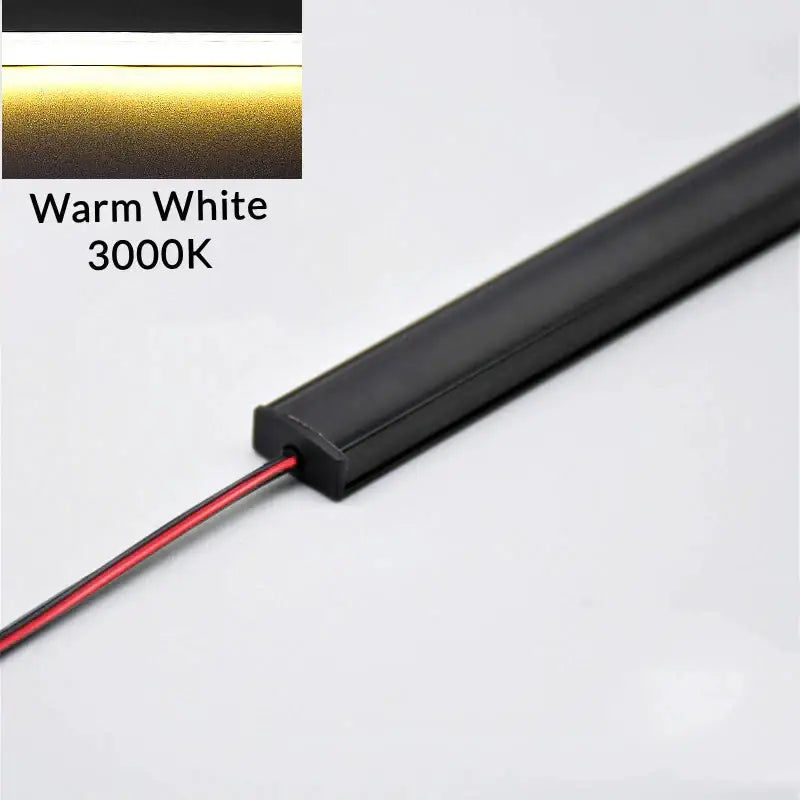 Black rectangular led bar strip light with warm white 3000k illumination for modern silver u-shape kitchen under cabinet use