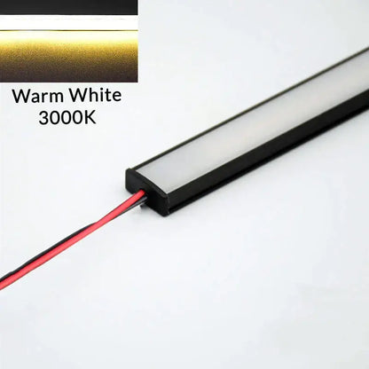 Modern silver u-shape led bar strip light with warm white 3000k leds, black housing, and visible wiring for kitchen use