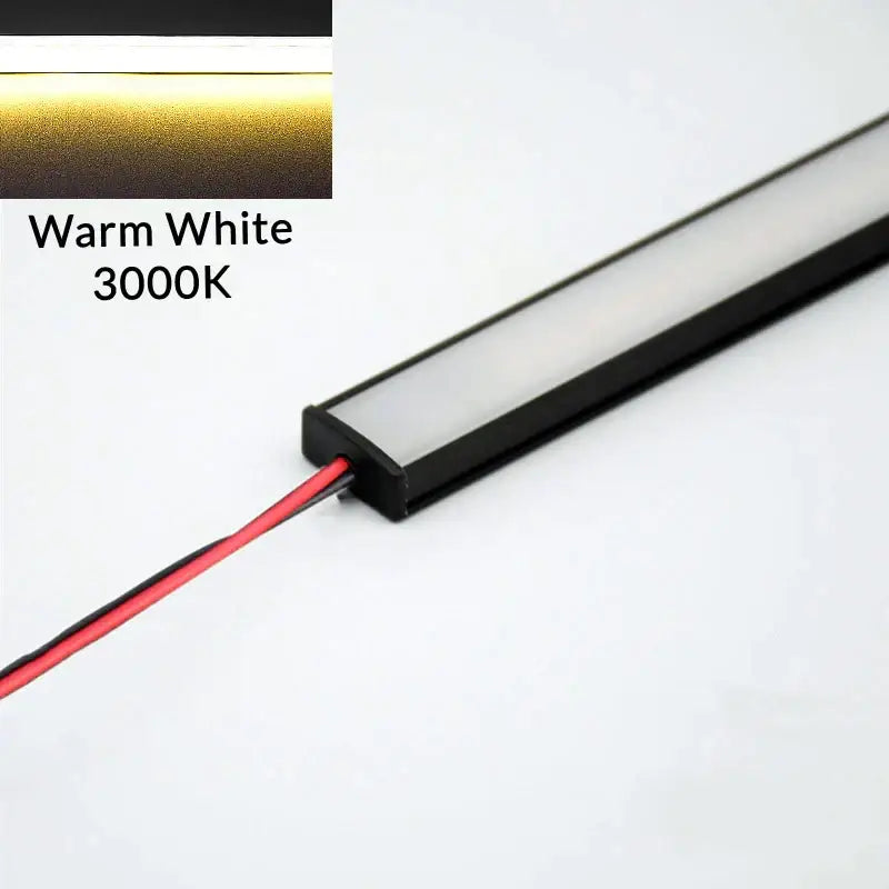 Modern silver u-shape led bar strip light with warm white 3000k leds, black housing, and visible wiring for kitchen use