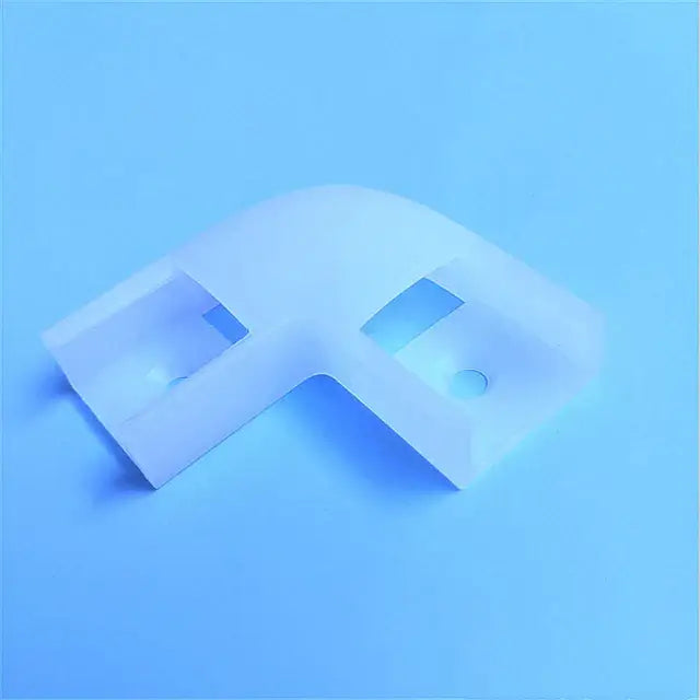 White translucent plastic l-shaped corner bracket with cutouts and holes for modern silver u-shape led bar strip light installation