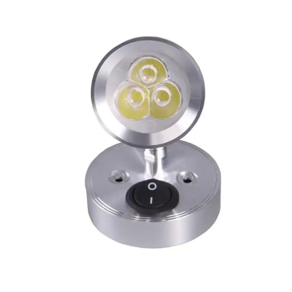 Modern silver circular led spotlight with three warm white bulbs and black switch for white boat interior lighting