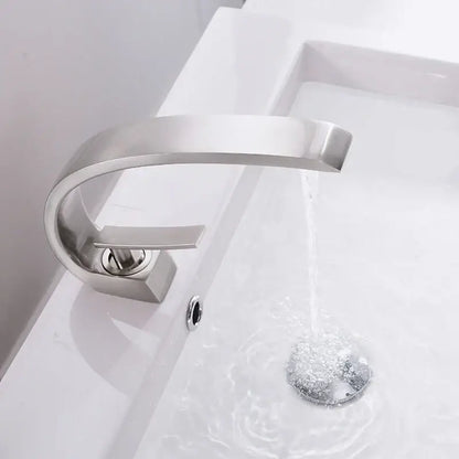 Modern silver waterfall basin faucet with brushed nickel finish and sleek curved spout by decorbites basin faucet