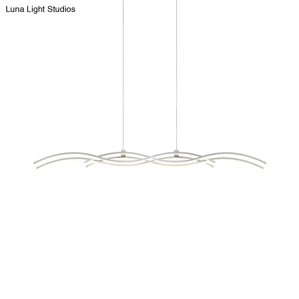 Modern silver-toned DecorBites acrylic LED island pendant light with flowing silver wave design and sleek minimalist style