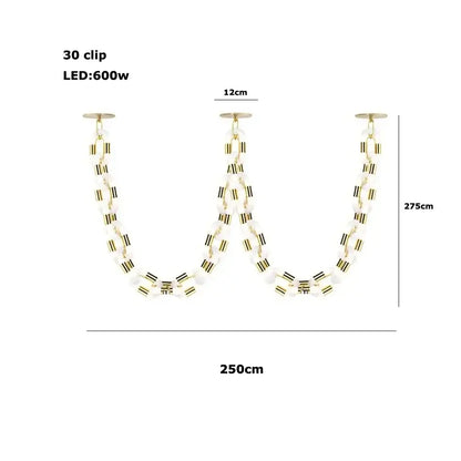 A modern gold chain chandelier with a sleek frame and white opaline beads for dining room decorbites crystal gold lighting