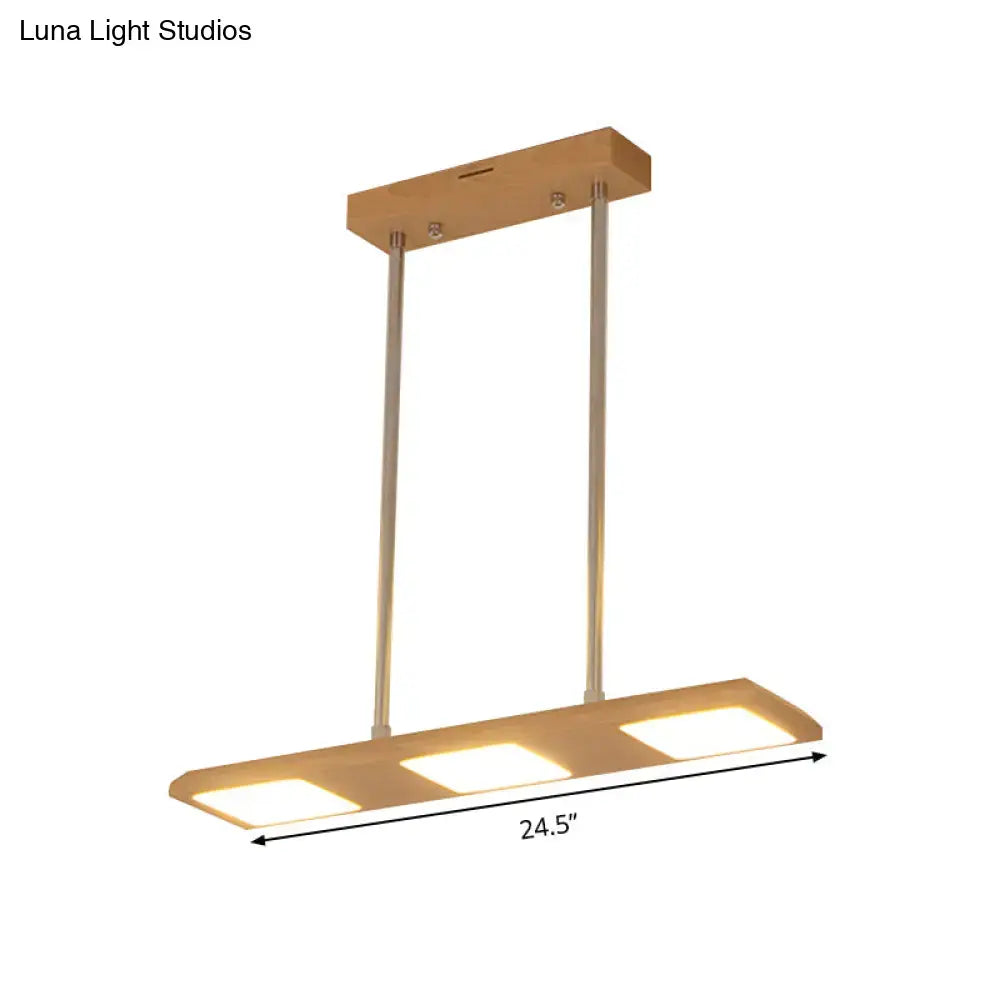 Modern simple rectangle wood island lamp with three warm led panels and sleek wooden top for dining room use
