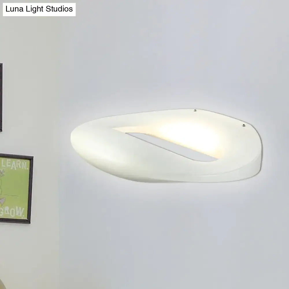 Modern smiling face black white wall lamp with a sleek white oval sconce and soft ambient led corridor lighting