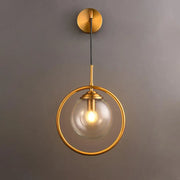 Gold-toned modern smoke gray clear glass globe sconce with circular frame and exposed bulb for bedroom wall light 220v-240v 110v-120v