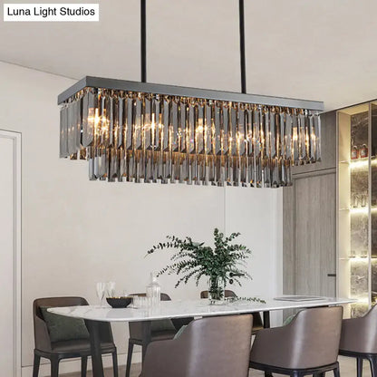 Modern smoke gray crystal rectangle chandelier with sleek metallic frame and cascading gray crystal block prisms for dining room