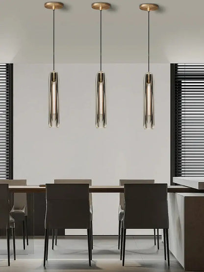Three modern pendant lights with smoky glass shades and brass tops for dining room decorbites crystal copper pendant