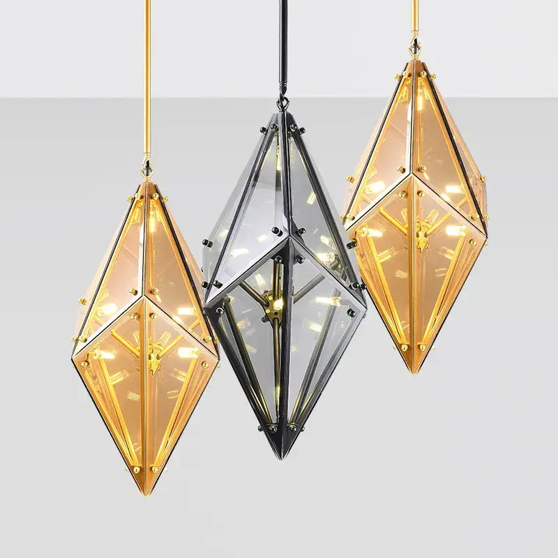 Three geometric amber and clear diamond glass led pendant lights with gold frames and clock faces for living room