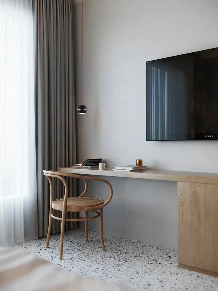Modern spherical gold led pendant lamp illuminating a minimalist wooden desk with integrated storage decorbites gold led