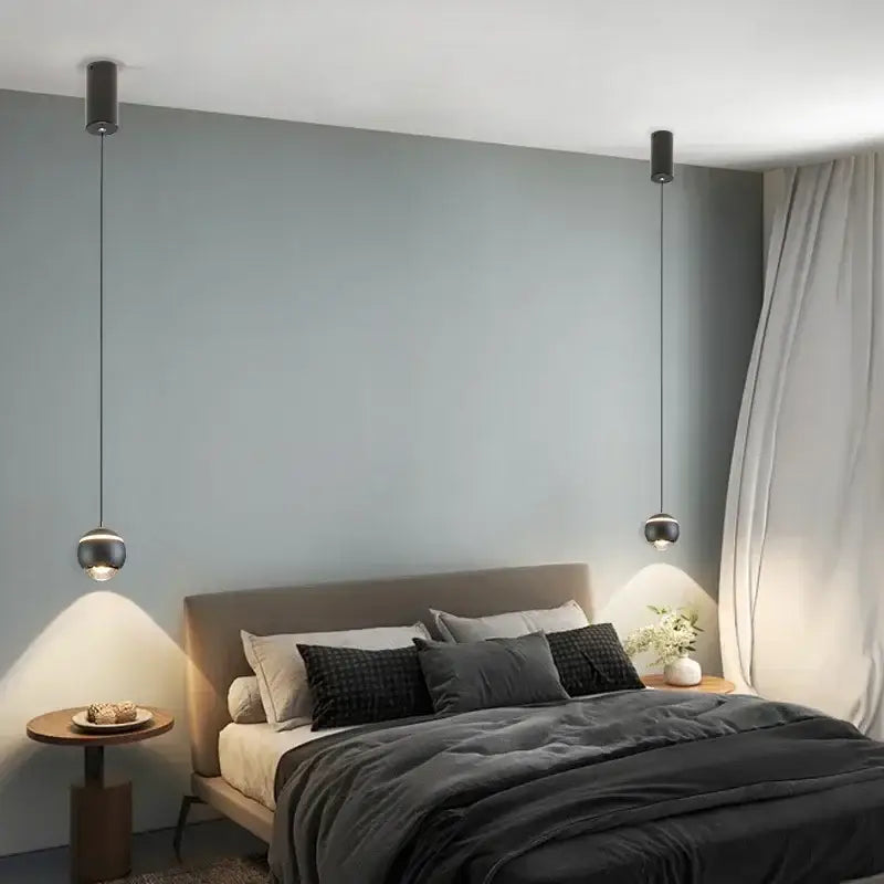 Modern black pendant light with sleek cylindrical fixtures and thin cords for led bedside lifting decorbites decor