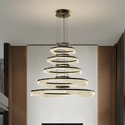 Modern spiral acrylic ring pendant light fixture with frosted glass and metallic rings for living room lighting