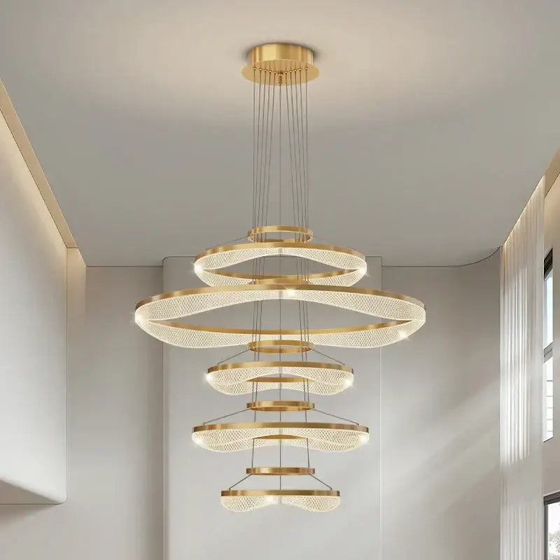 Modern spiral acrylic ring pendant light fixture featuring a golden spiral chandelier with crystal accents for living rooms