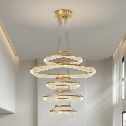 Modern spiral acrylic ring pendant light fixture featuring a golden spiral chandelier with crystal accents for living rooms