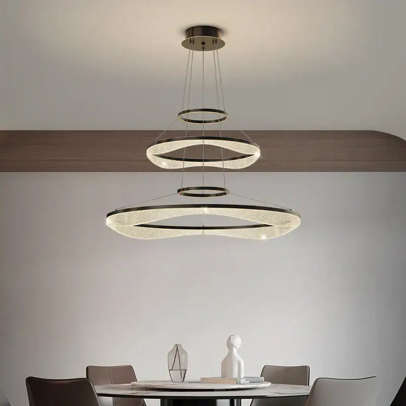 Modern spiral acrylic ring pendant light fixture with three black metal concentric rings and crystal accents for living room