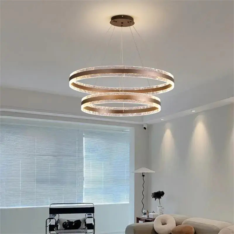 Modern spiral circle rings led chandelier with brushed gold finish and crystal accents for living room decorbites circle rings