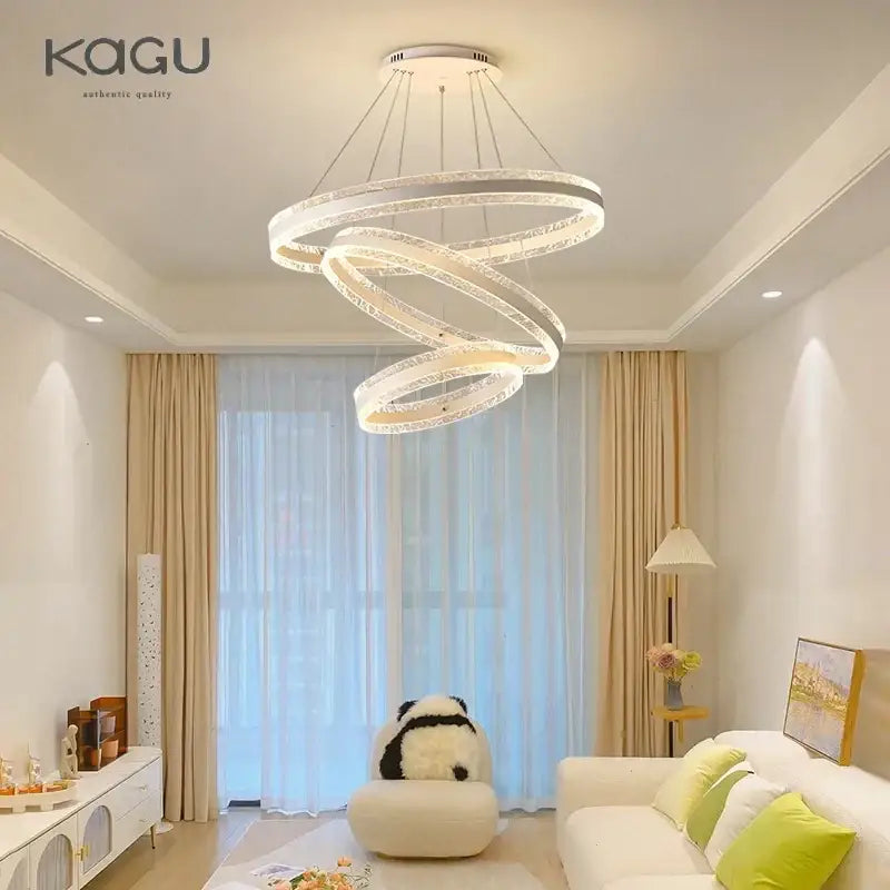 Modern spiral circle rings led chandelier with glowing rings crystal accents and sleek metallic finish for living room decorbites circle rings