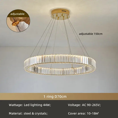 A modern spiral decorbites crystal circle led chandelier with clear crystal segments and gold-toned steel ceiling mount