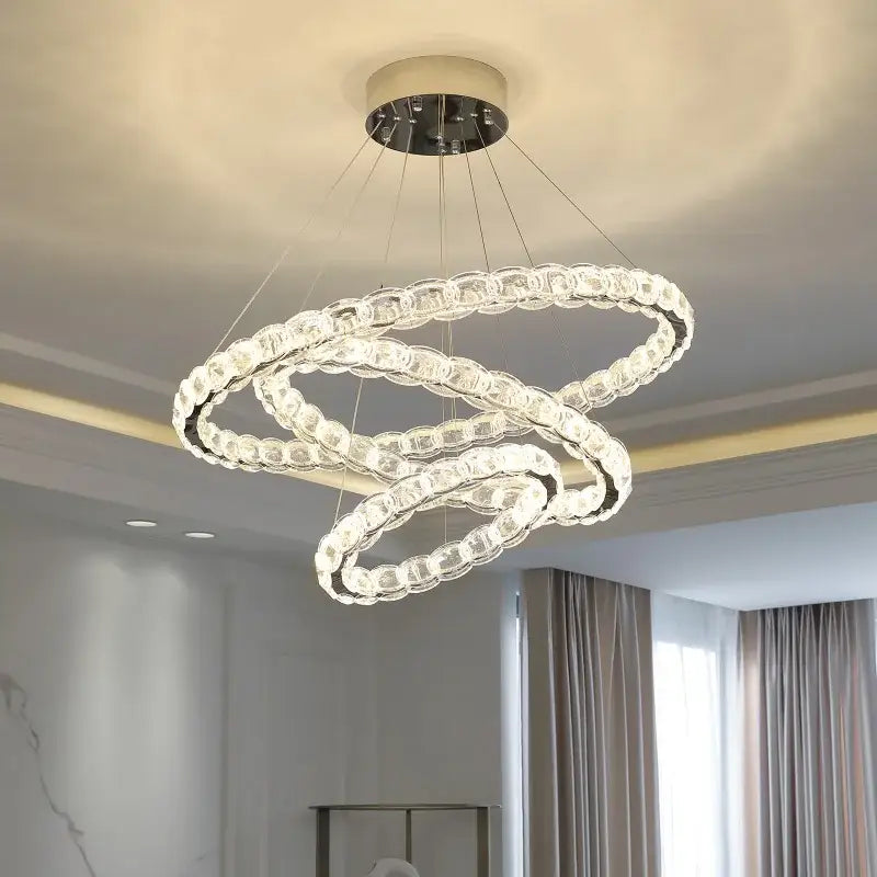 Modern spiral interlocking decorbites crystal chandelier with crystal-clear rings and sleek chrome base for living room