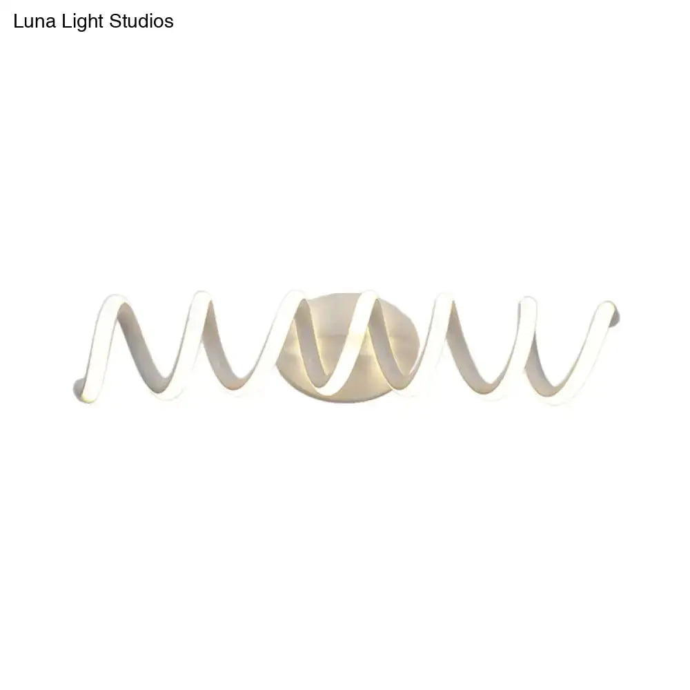 Modern spiral white wall light with sleek wavy design and metallic base providing natural warm white natural LED sconce lighting