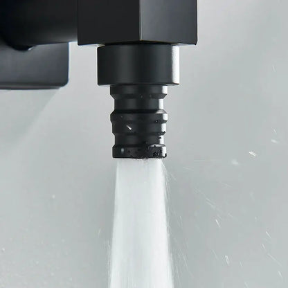Modern square black brass wall mounted washing machine faucet with black brass matte showerhead emitting water stream