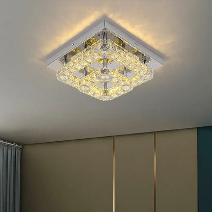 Modern square chrome crystal led ceiling light with layered faceted crystals emitting warm light for living room use