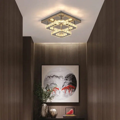 Modern square crystal ceiling chandelier by decorbites with geometric layered design and warm golden lighting for dining rooms